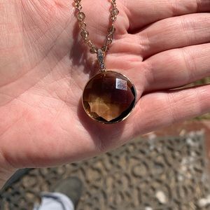 Gold and beaded necklace with brown clear pendant
